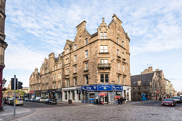 Edinburgh, Scotland, UK - February 14, 2025: The Royal Mile is situated in the Old Town and is located within a UNESCO World Heritage site; the area is filled with shops, bars, and restaurants.