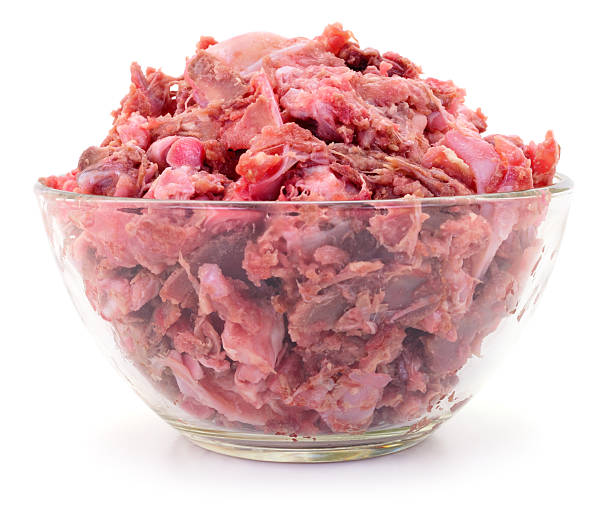 istock Minced meat and bones for pets in glass bowl isolated 2256857003