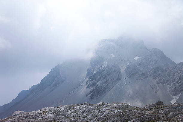 Majestic Jade Dragon Snow Mountain Peak Enveloped in Thick Mist