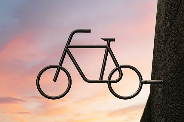 silhoette of bicycle against dramatic sky