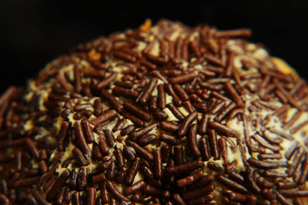 Closeup of a pain au chocolat or napolitana. Isolated on a black background