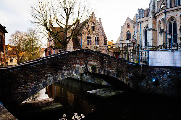 Canal in Bruges with beautiful old bridge in spring
