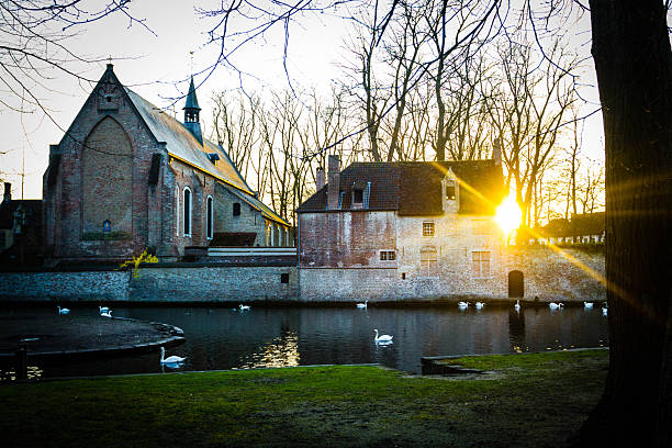 Old yard in Bruges at sunset