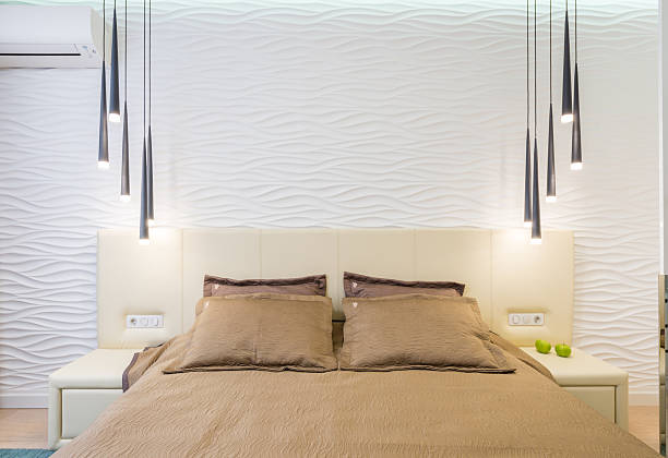 Modern Minimalist Bedroom Interior with Soft Neutral Bedding, Decorative 3D Wall Panels and Pendant Lights, Elegant Contemporary Bedroom Design with Symmetry and Calm Atmosphere