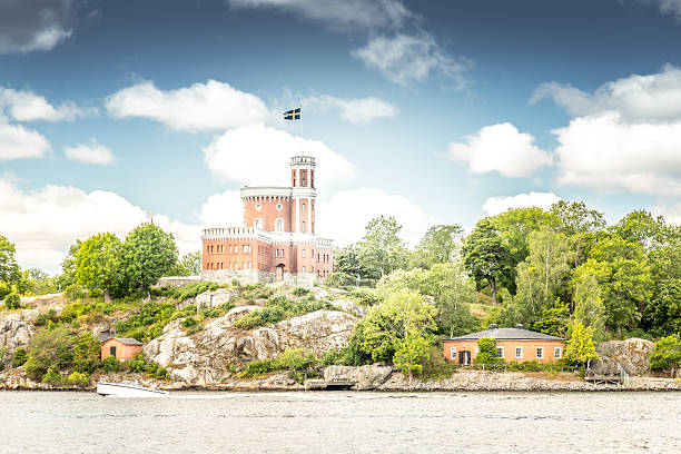Vyborg, Leningrad Oblast, Russia - June 06, 2023: Part of fortress in Vyborg of 11 centuries. Vyborg Castle exterior. Old stone wall with windows