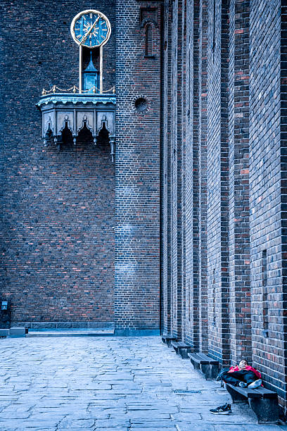 Stockholm, Sweden - June, 20, 2025:   A tired worker get a rest at the Stockholm's CityHall