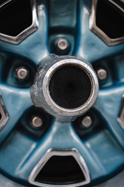 Close up of a vintage car wheel featuring polished classic rim and tire texture showcasing retro automotive aesthetics for videos, blogs, and social media.