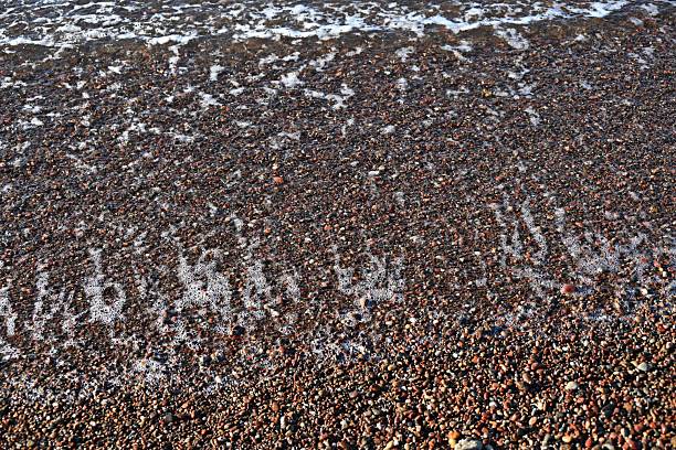 Shining blue sea water surface texture background of the shallow sea.