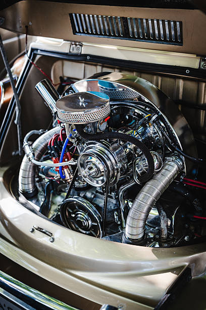 Focused view of a retro car engine highlighting chrome accents, metallic textures, and classic mechanical design for automotive enthusiasts and editorial projects.