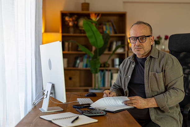 istock Mature adult man working from home office 2256907738