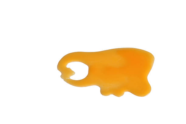 Puddle of pumpkin juice isolated on white background.