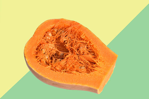 Sweet ripe pumpkin lies on a colored background.