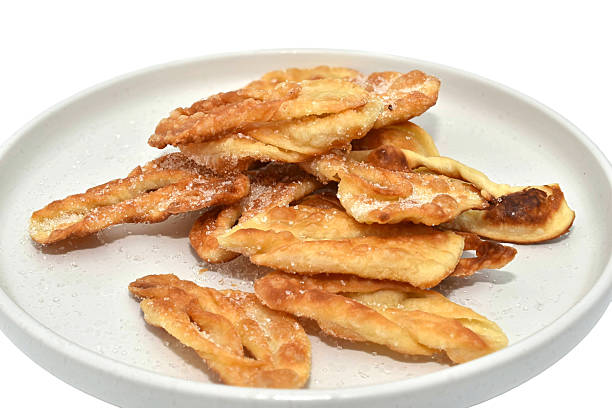 Sweet fried puff pastry lies on a plate.