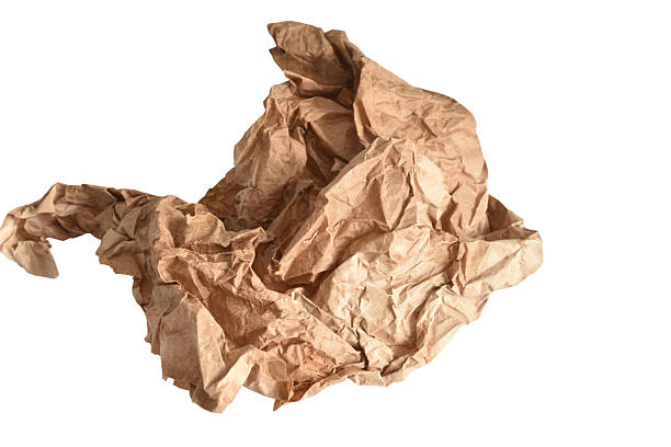 Crumpled brown paper ball isolated on white background.