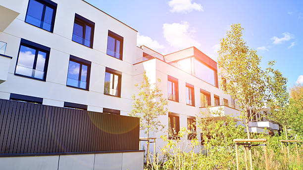 istock Modern apartment building with balconies and greenery. 2256928489