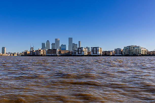 London, England. 4th January 2026. A photograph of Canary Wharf as viewed from the River Thames in London, England. The photograph was created on a bright but extremely cold winter day