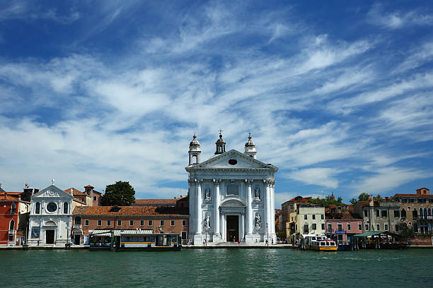 Picturesque view of gondolas floating on the canals of Venice, Italy, surrounded by historic buildings and charming bridges. A classic scene from one of the world’s most iconic and romantic travel destinations. Ideal for tourism, European culture, and architectural beauty.