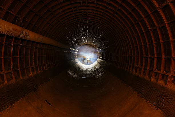 Scenic view from a tunnel under the highway in Carrion de los Cespedes, Sevilla, Spain. Captures the rural landscape and architectural structure.