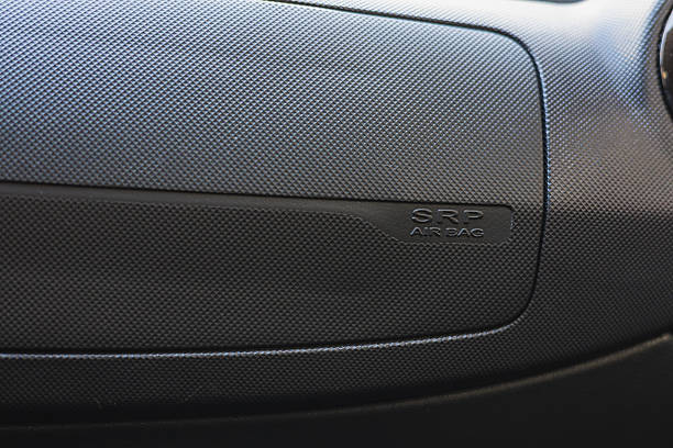 A close-up view of an airbag panel in a car. The panel shows the lettering for airbag and highlights the safety measures in vehicle design.