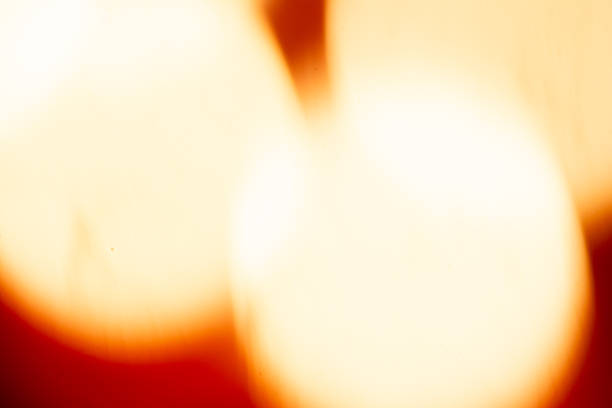 Burning candles and christmas decorations on a dark background