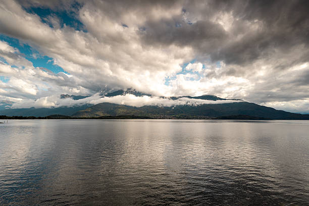Rain clouds over the mountain and lake Como, Italy
