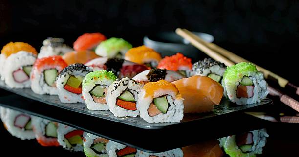 Assorted Sushi Platter With Colorful Varieties, Brightly Arranged Assortment Of Sushi With Accompaniments