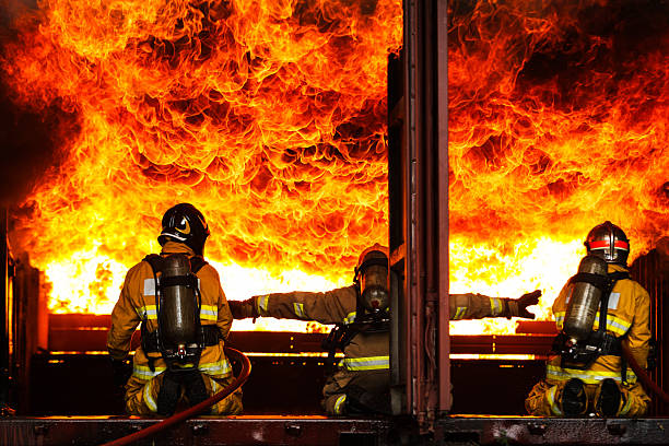 fire fighters fighting fire at Buncefield oil storage facility explosion and fire Hemel Hempstead. UK. disaster zone  December 2005
