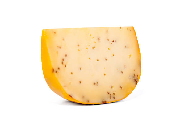 Piece of Gouda with cumin isolated on white
