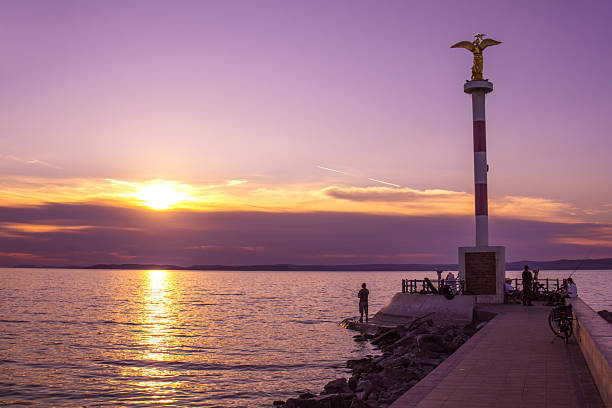 Siofok, Hungary - September 22, 2025: Sunset view of the Siofok Pier on the Lake Balaton.