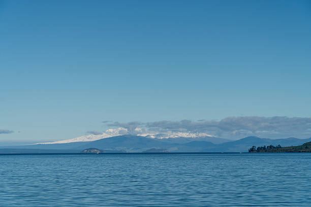 View of Lake Taupo with Mountains in the background in New Zealand