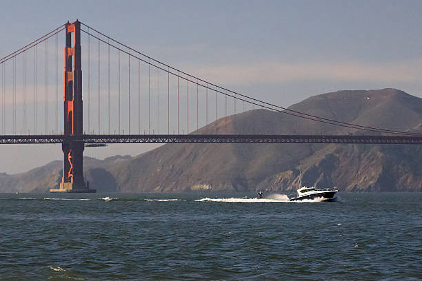 Marin, California, United States - May 19, 2016: Catamaran Sailboat About To Go Under Golden Gate Bridge Out To Sea