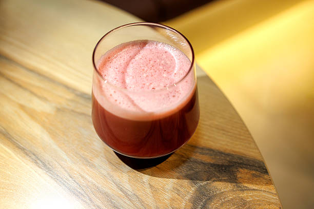 Fresh Beetroot Juice in Glass on Wooden Table Indoors
