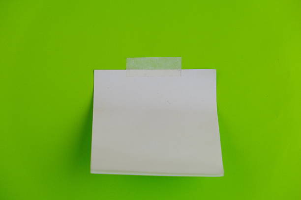 Blank green post-it note isolated on white