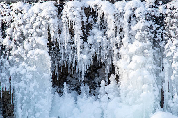 icicles in the mountains close-up texture against a sunset background