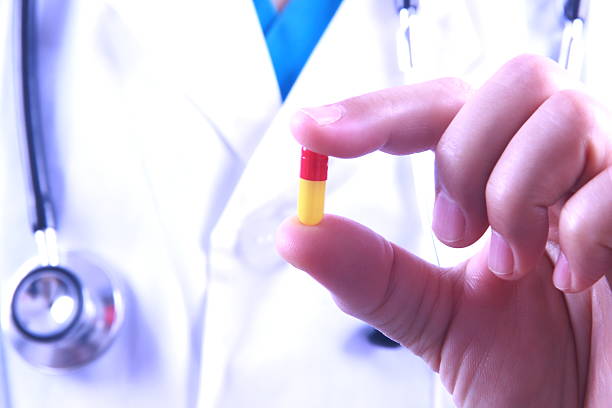Male doctor holding medicine