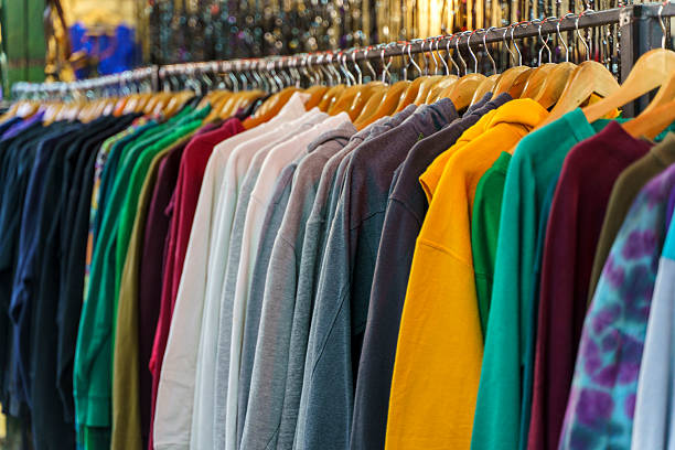 istock Assorted Vintage and Second Hand Clothing on Hangers in a Thrift Store 2257004378