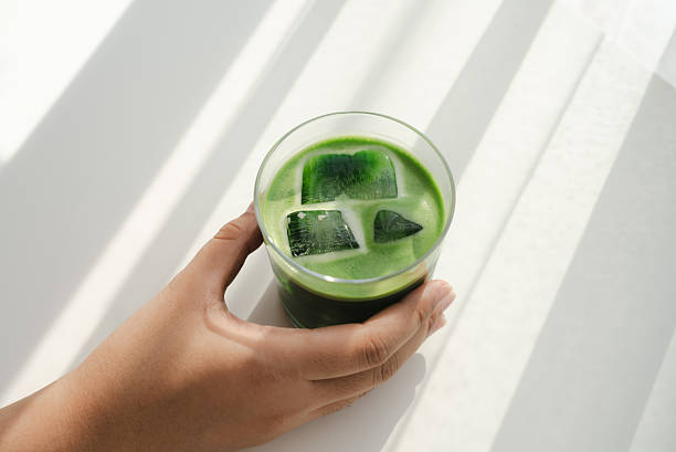 Hand Holding Iced Matcha in Natural Light