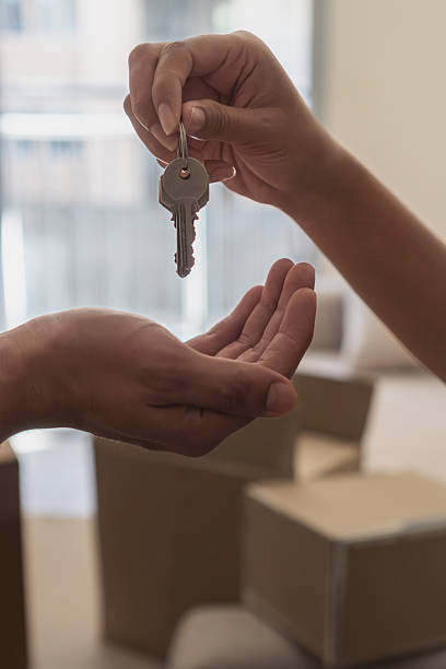 istock Handing over keys for new home ownership achievement 2257015598