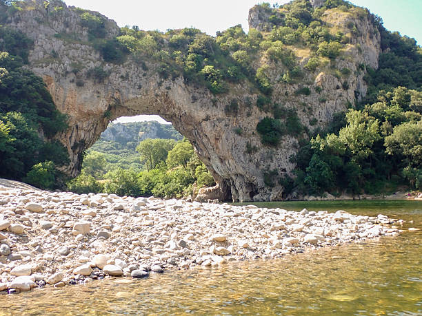 Pont d'Arc natural bridg in the Ardeche river in the Ardèche département in France during a warm summer day.