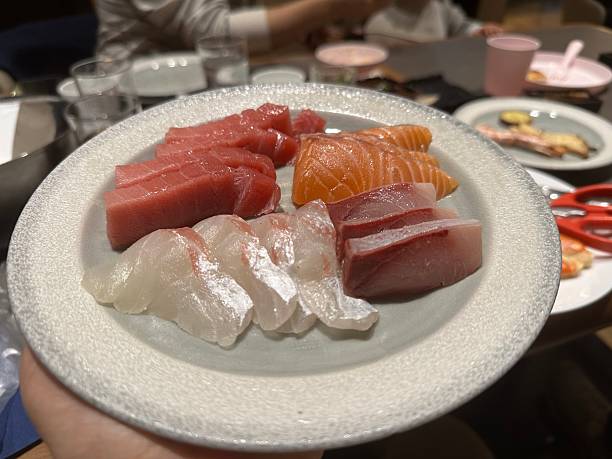 tuna and salmon carpaccio on a plate in Berlin, Berlin, Germany