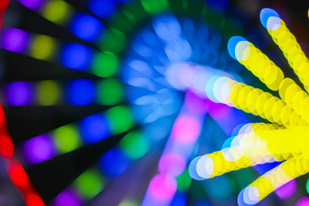 An abstract circular lattice composition created from colorful light bokeh arranged in a precise radial structure. The repeating framework forms a mesh like pattern with layered depth and motion, visually representing connectivity and modern systems. The luminous design suits premium branding, digital innovation concepts, creative technology visuals, and contemporary abstract backgrounds for editorial or commercial projects.