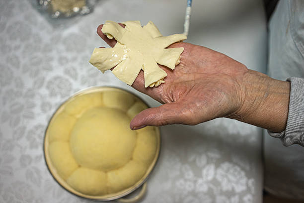 Traditional preparation and decoration of Serbian Slavic cake.