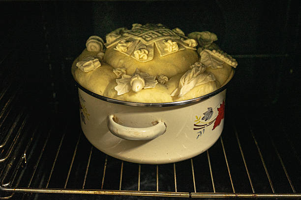 A traditionally decorated Slavic cake ready to be baked in the oven.