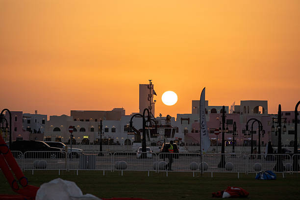 Doha, Qatar - January 18, 2026: Spectators enjoy the large kites flying at Mina district in Qatar as part of Kite Festival 2026. Families and young children in Qatar enjoys the kite festival.