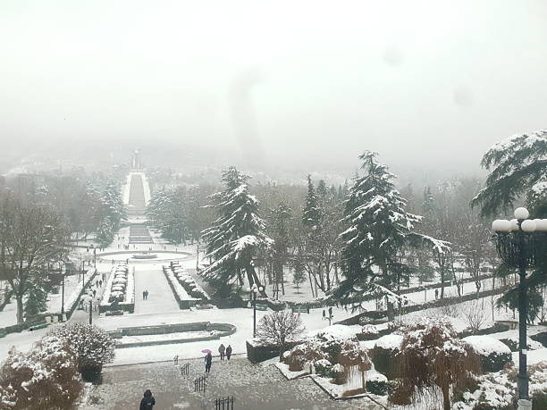 Snowing in park Vake in Tbilisi