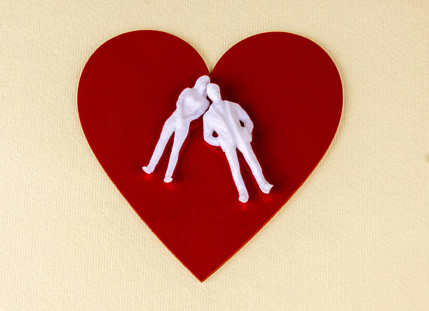 Relationship problems breakup heartbreak white figures of a couple apart on red heart Divorce separation marriage crisis emotional distance relationship counseling love problems romantic conflict Valentine's