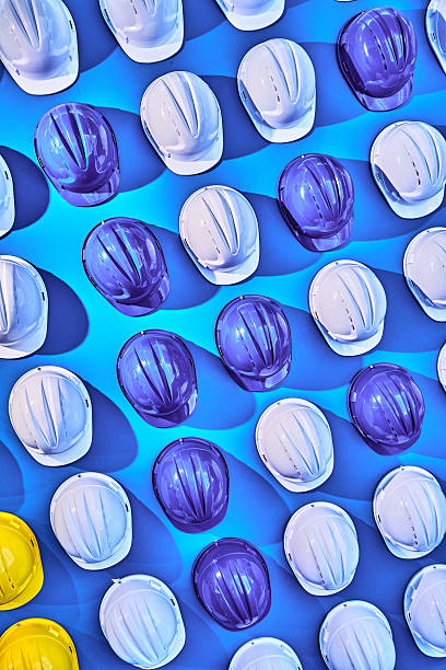 Safety helmets lined up on the wall