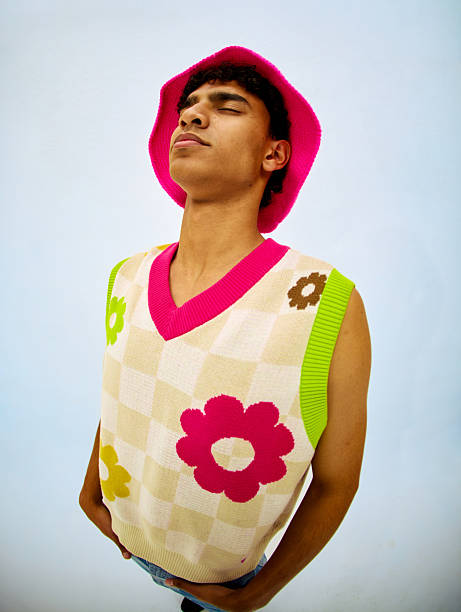 Gen z man with eyes closed relaxing in studio