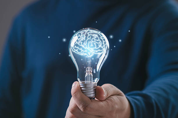 istock Hand holding glowing light bulb with digital human brain inside, symbol of intelligence, smart thinking, artificial intelligence, innovation knowledge for technology, education business development. 2257042769