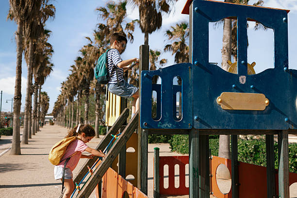 Kids climbing and playing at outdoor playground
